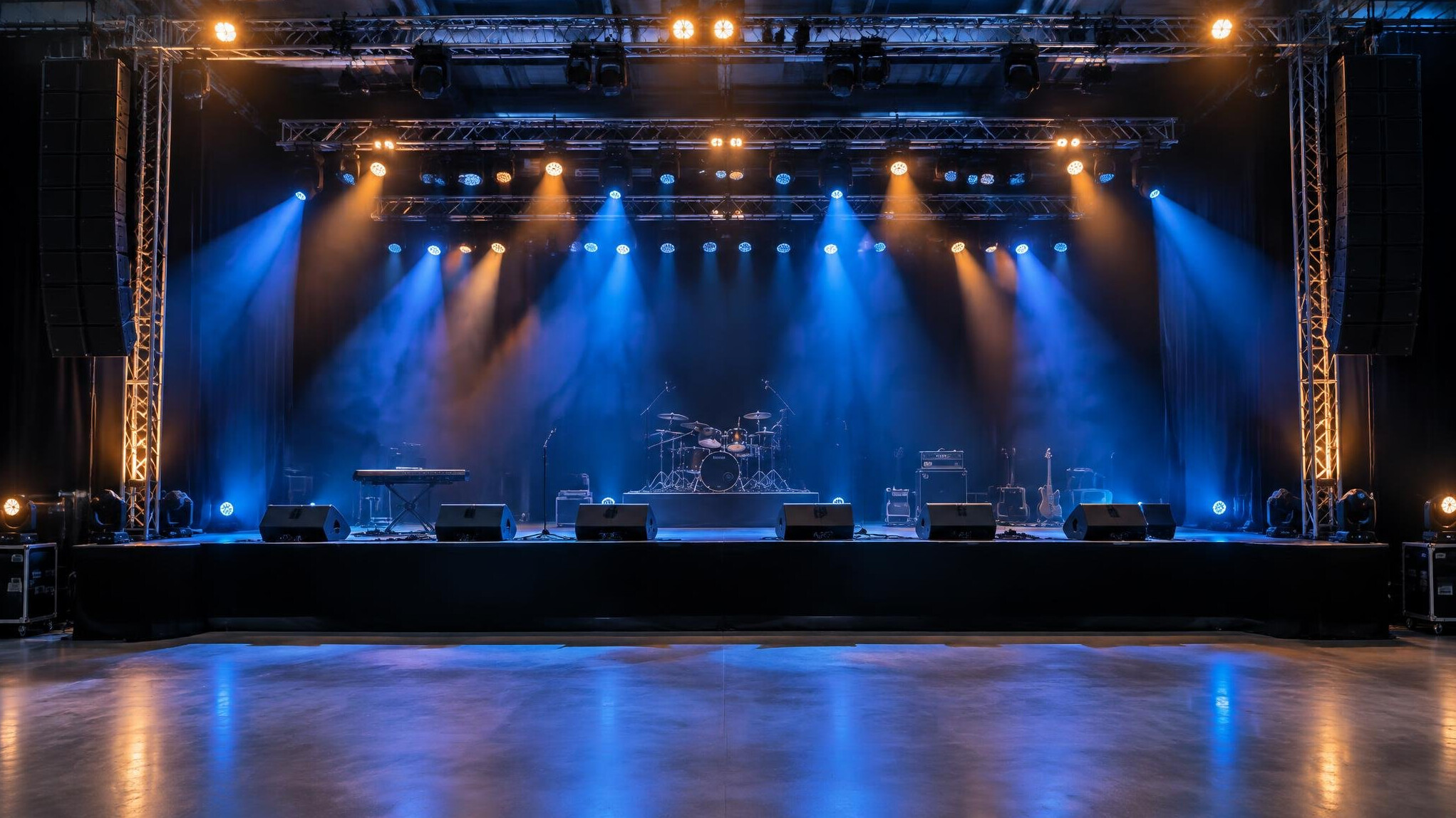 Live stage with colorful lighting rigs and a crowd